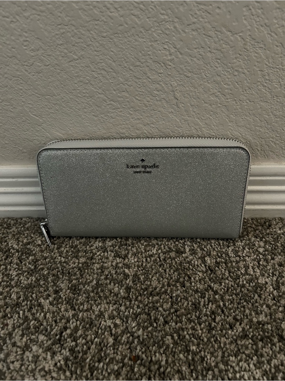 Kate Spade silver zip-around wallet